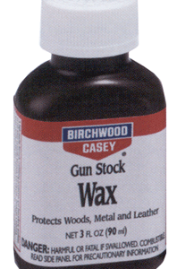 Bottle of Birchwood Casey Gun Stock Wax with white cap; label notes it protects wood, metal and leather.