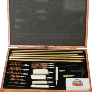 Open wooden case containing a complete rifle cleaning kit: brass cleaning rods, bronze brushes, patches, jags, a handle, and a small bottle of solvent or lube.