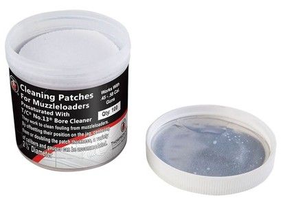 Jar labeled Cleaning Patches for Muzzleloaders with contents visible, open lid showing blue cleaning patches
