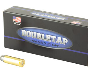 Box of DoubleTap Ammunition with two yellow rifle cartridges beside it.