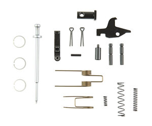 Assortment of small hardware parts (springs, pins, washers, cotter pins, metal rods, and a black plastic piece) on a white background.