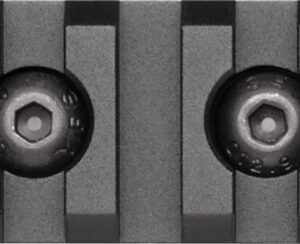 Close-up of a gray ribbed metal plate with two round hex socket screws set in circular recesses.