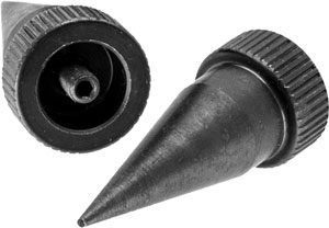 Two black piping nozzles for cake decorating, with one cap removed from the tip cap nearby.