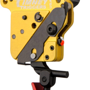 Yellow trigger mechanism with black linkage, red adjustment knob, and a mounting hinge visible.