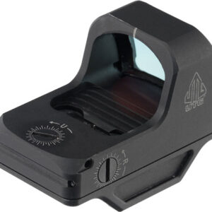 Compact black reflex sight with a small window and side adjustment dial, for firearms, viewed from a top-front angle