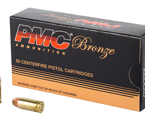 Box of PMC Bronze ammunition (50 centerfire pistol cartridges) with two brass pistol rounds next to it.