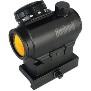 Bushnell red dot sight with elevation and windage dials, yellow lens, mounted on a base.