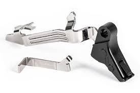 Pair of road bike brake/shift levers (brifters) with metal levers and black housing on a white background.