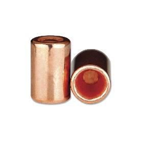 Two copper cartridge casings (ammunition), one standing upright and one lying on its side.