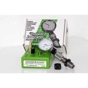Green Redding instant indicator case comparator kit with dial gauge and attachments, box in background.